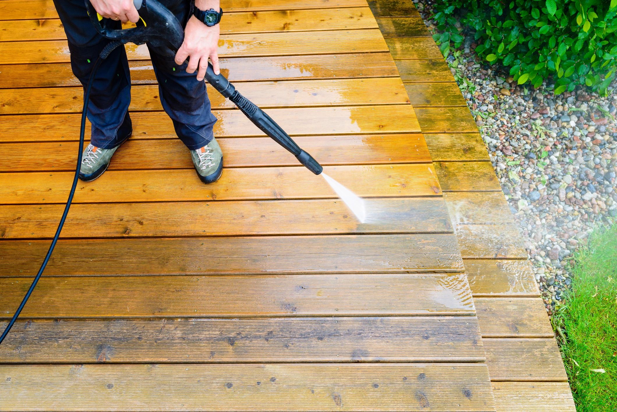 Team member operating pressure washer