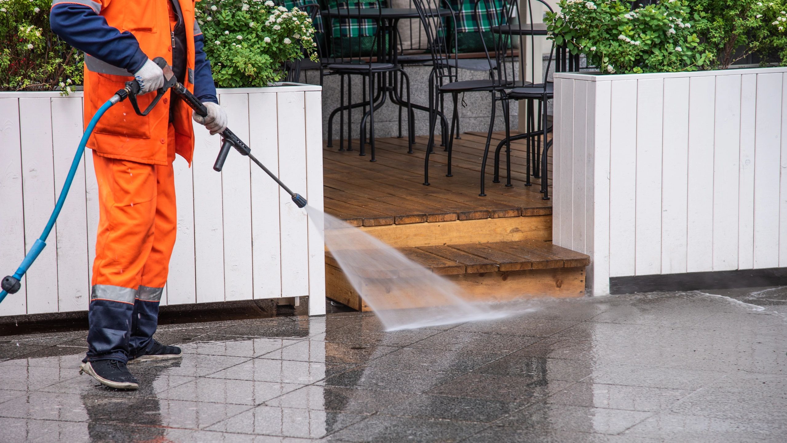 Commercial building being pressure washed